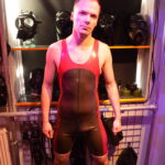 switchLDN in red and semi trans latex rubber wrestling suit front view